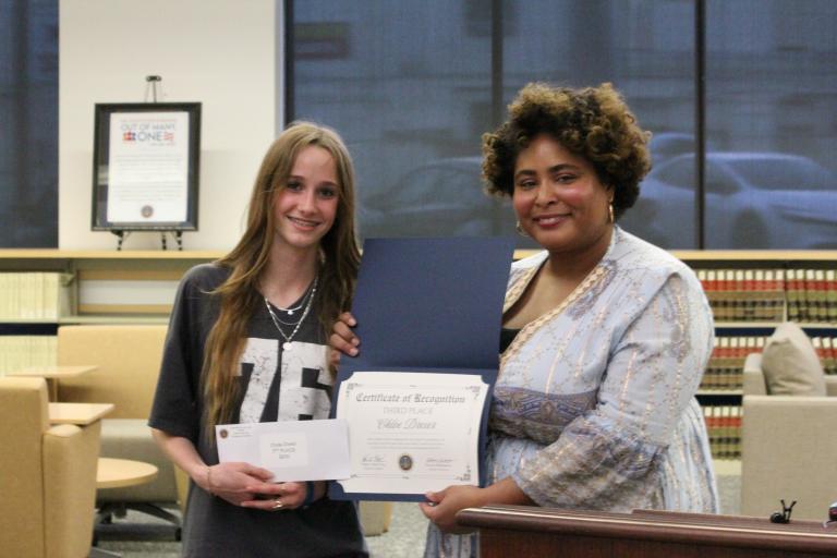 Chloe Dreier handed an award by Lauren Patterson