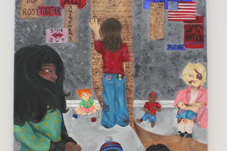 a woman holding a child’s hand, a teenager reading the constitution with two back pockets of the Mexican and American flag, and infants sitting on the ground. Posters scattered in the background say things such as, “Speak out,” “Remember our roots,” “We are the future,” “US as a nation,” “Liberty & Justice 4 ALL,” and “America the GREAT.”