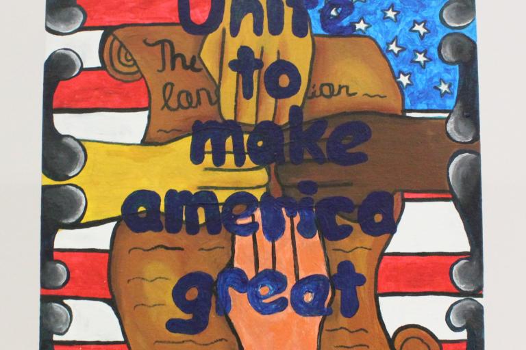 four hands meeting in the middle, symbolizing unity, on top of the Constitution which is layered on top of the US flag. In front of the hands is written, “Unite to make America great.” 