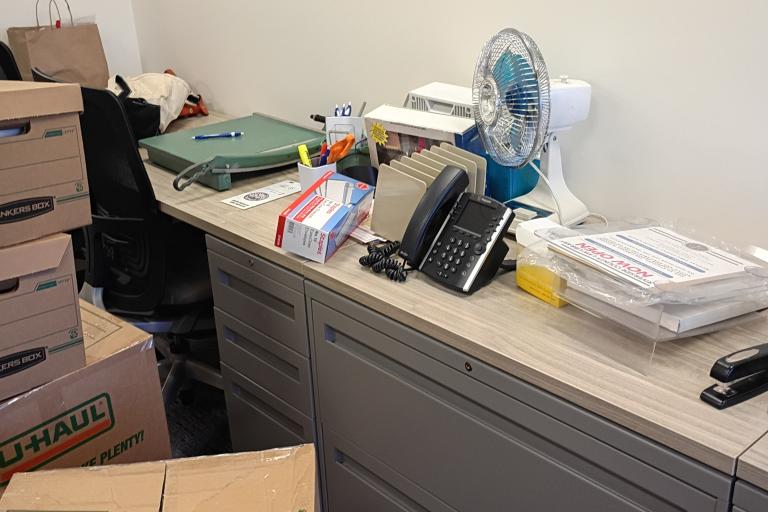 Unpacked office supplies in a library office.