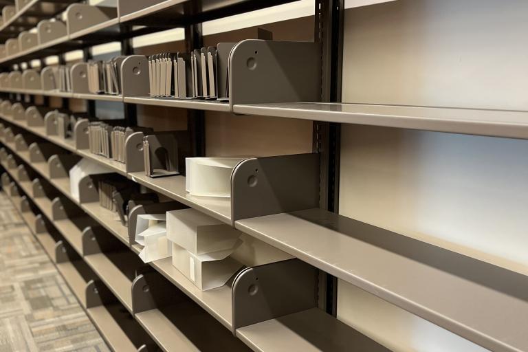 Photograph of bare shelves at the Indio Branch.