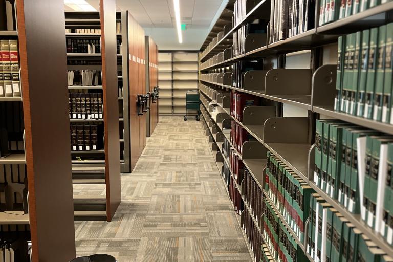 Photo of half-empty bookshelves at the Indio Branch.