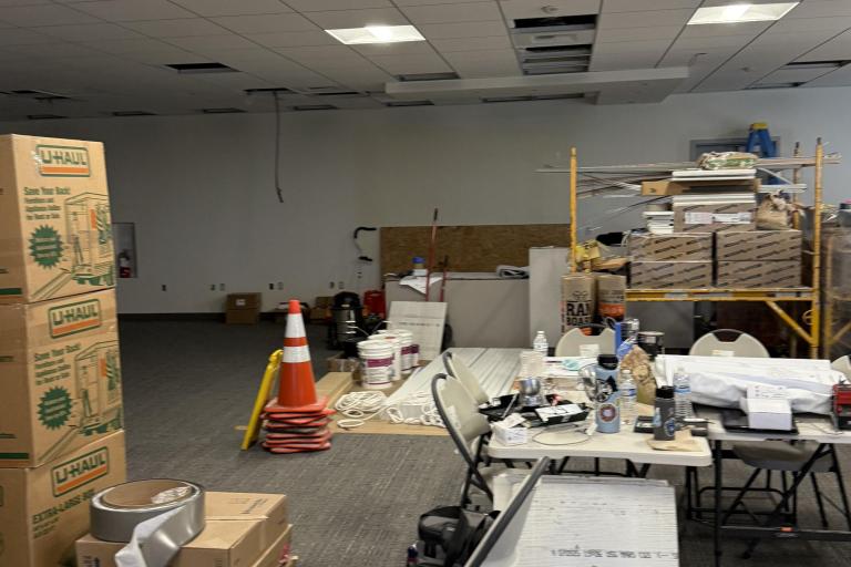Photo of construction and moving boxes within the new Palm Springs Law Library.