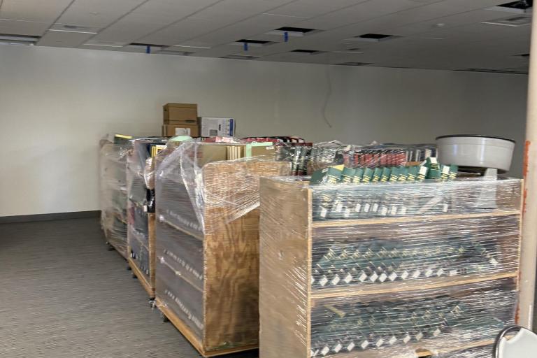 Photo of wrapped book carts within the cleared space of the Palm Springs Law Library.