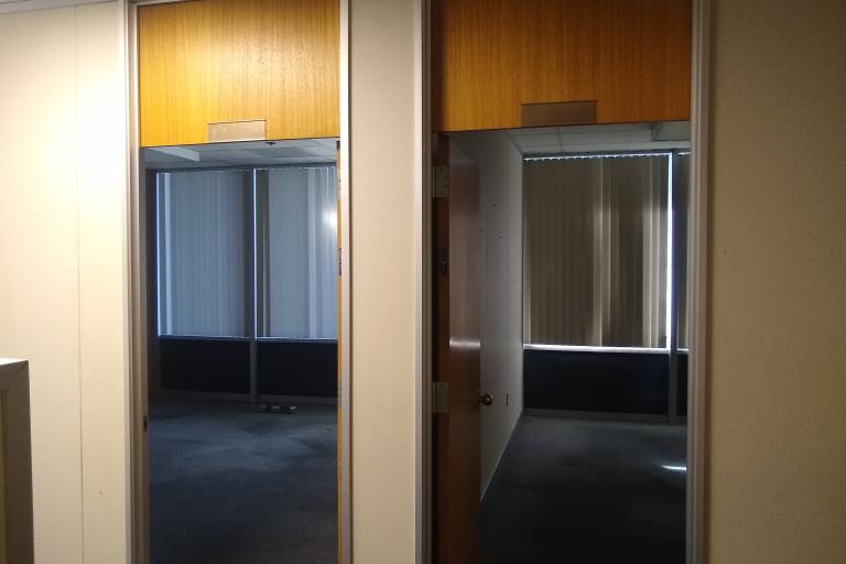 Photo looking through the doorways of two offices in the Palm Springs Courthouse.