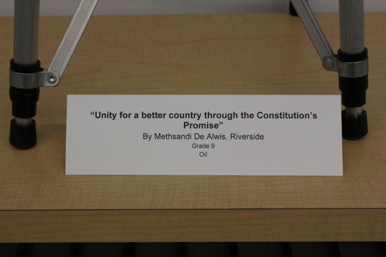 "Unity for a Better Country through the Constitution's Promise" by Methsandi De Alwis placard.