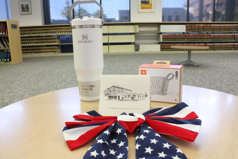 The prizes: a Stanley cup, JYBL speaker, and RCLL printing card.