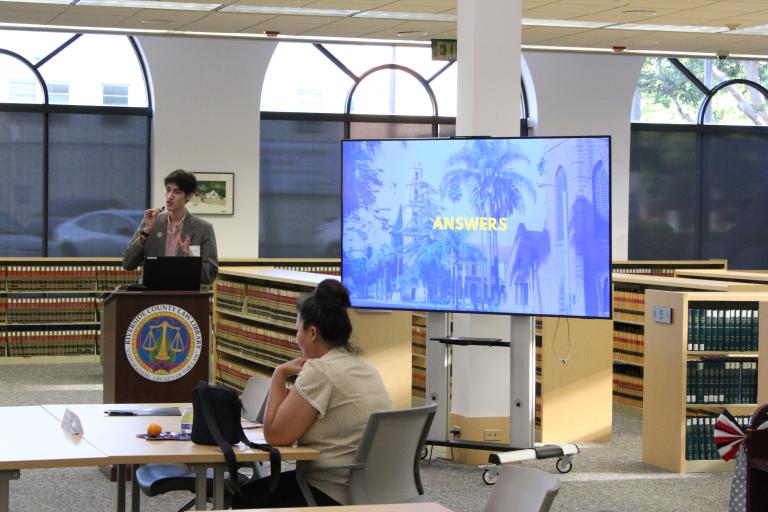 A library staff member presenting trivia.