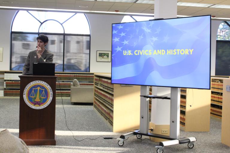 A library staff member presents trivia.