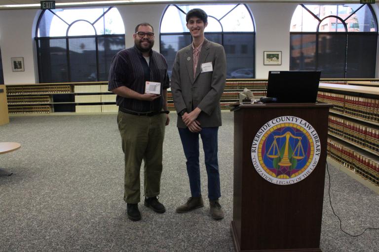 A library staff member with the second place winner.