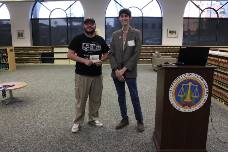 A library staff member with the first place winner.