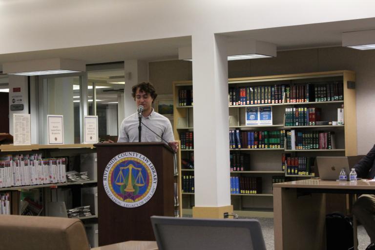 A library staff member give introductory remarks.