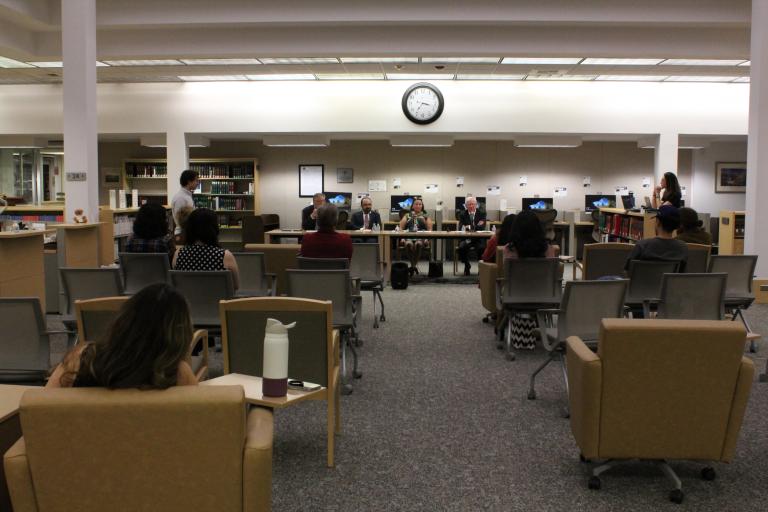 Attendees watch the panel discussion in the California Reading Room.