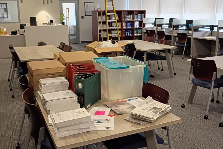 Books unpacked on the reading tables.
