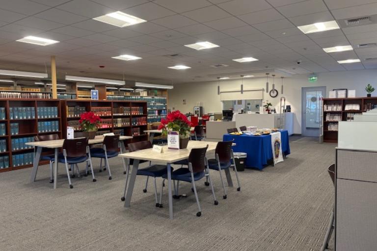 Palm Springs reading room with poinsettias and reopening table display.