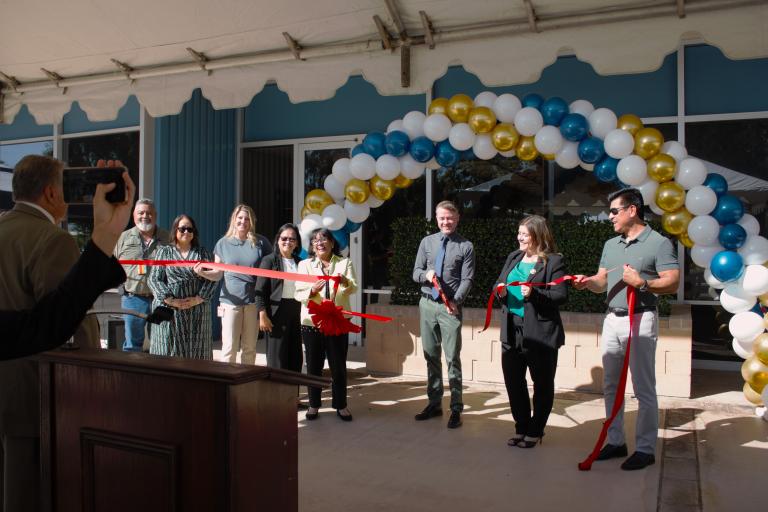 Judge Michael Martin cutting the ribbon of the Palm Springs Law Library.