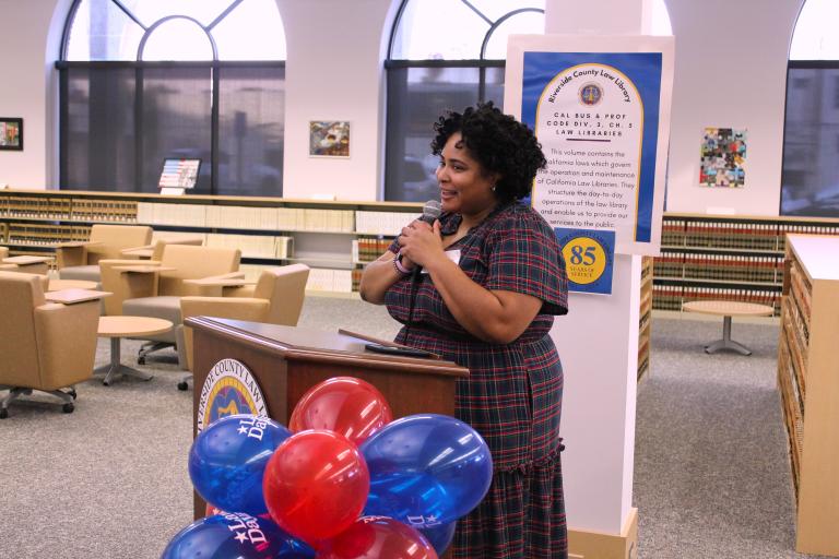 Administrative Officer Lauren Patterson delivers remarks at the art contest awards ceremony.