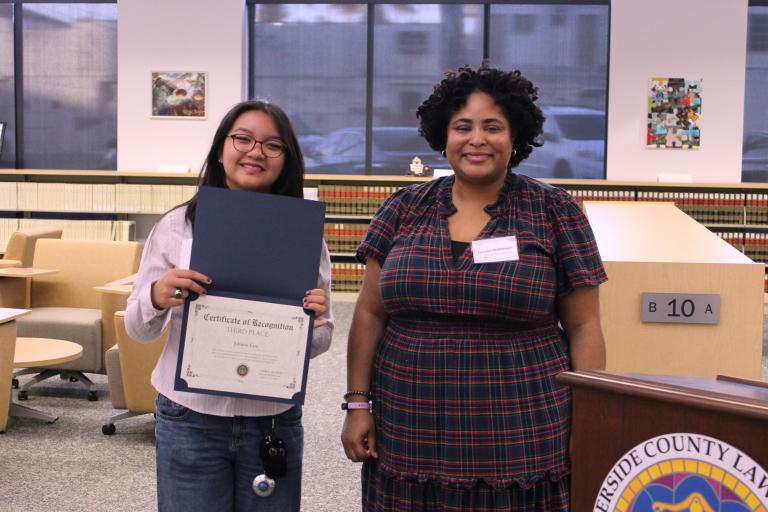 Administrative Officer Lauren Patterson presents the third place certificate to Julianne Lim.