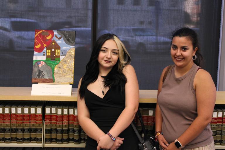 Entrant Jennavecia Hernandez with family and her artwork, "The American Dream"
