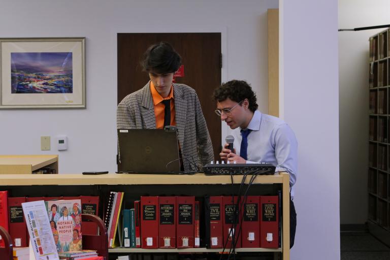 Library Assistants Matthew Palacios and Yanis Azzou read a question from the Zoom chat