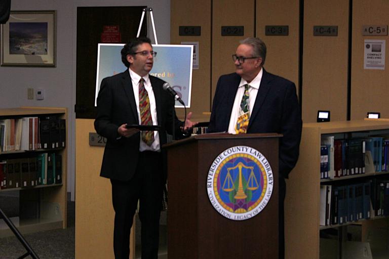Attorney Barak Berlin accepts the Volunteer Service Award.
