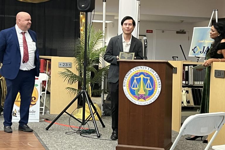 Pro Bono Coordinator David Friedman accepts the Community Partnership Award for the Legal Aid Society of San Bernardino