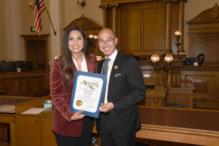 Assemblymember Sabrina Cervantes presents a Certificate of Recognition to RCLL Board President Jack Lucky