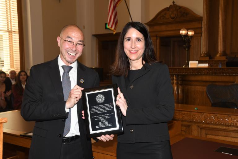 RCLL Board President Jack Lucky presents Chief Justice Patricia Guerrero w/ a recognition plaque