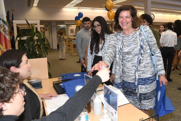 RCLL staff checking in RCLL Past Board Member Judge Gloria Trask (Ret.)