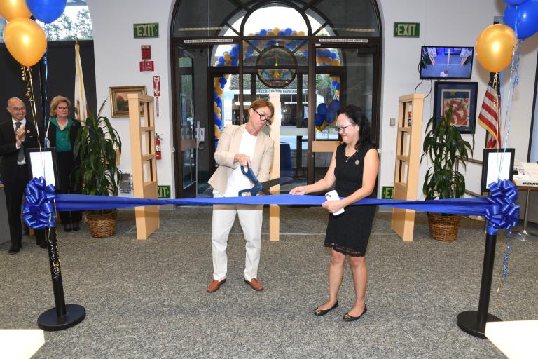 RCLL Past Board President Judge Michele Levine (Ret.) and RCLL Director Victoria Williamson cutting the ribbon