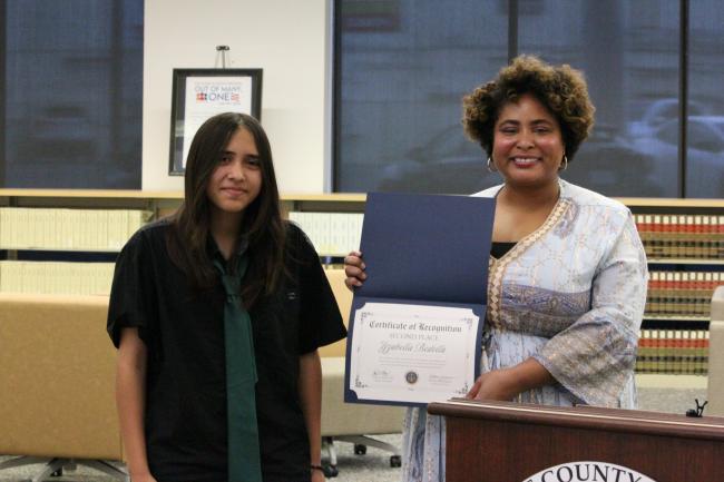 Yzabella Bedolla handed award by Lauren Patterson