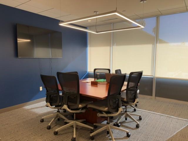 Palm Springs main conference room, able to seat eight.