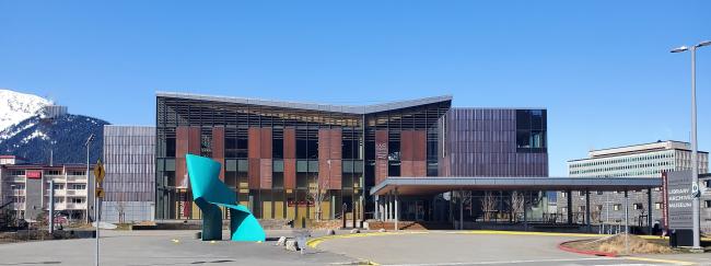 Exterior of the Alaska State Library, Archives, and Museum building along with the sculpture, "Nimbus".