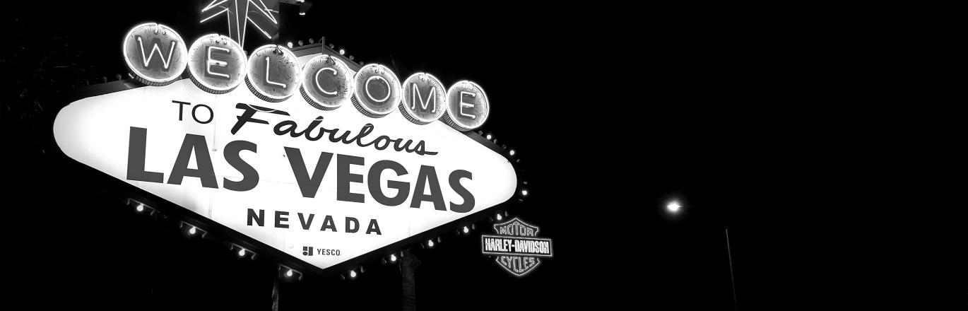 Black and white photograph of the "Welcome to Fabulous Las Vegas, Nevada" neon sign on the Las Vegas Strip.