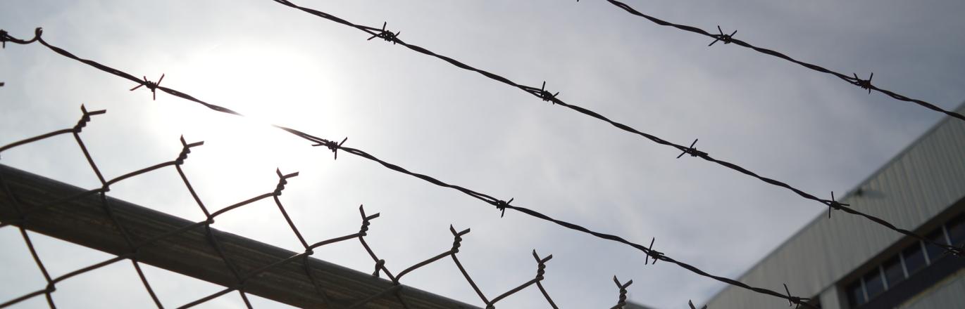 chain link fence with barbed wire
