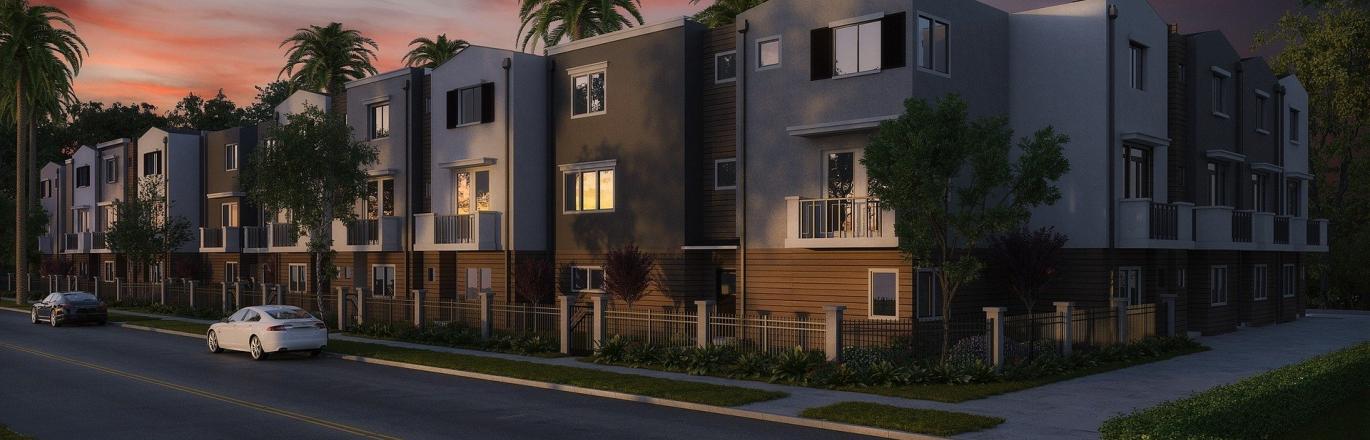 a line of condos at dusk with palm trees out front