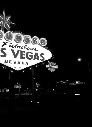 Black and white photograph of the "Welcome to Fabulous Las Vegas, Nevada" neon sign on the Las Vegas Strip.