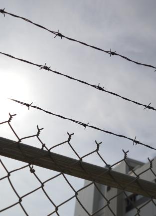 chain link fence with barbed wire