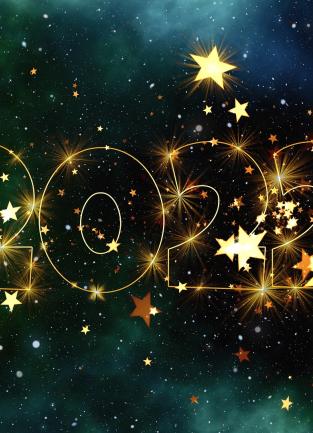 dark background with gold lettering saying 2022 with stars